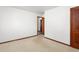 Bedroom with carpet and an open doorway to another room at 369 Albany St, Burlington, NC 27215