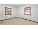 Carpeted bedroom with dual windows allowing for natural light at 369 Albany St, Burlington, NC 27215