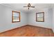 Bedroom featuring original hardwood floors and two windows at 369 Albany St, Burlington, NC 27215