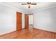 Bedroom with ceiling fan and hardwood floors at 369 Albany St, Burlington, NC 27215