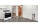 View of the kitchen featuring a white oven appliance and stone-look flooring at 369 Albany St, Burlington, NC 27215