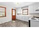 Bright kitchen features white cabinets, and ample counter space at 369 Albany St, Burlington, NC 27215
