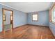 Spacious living room with hardwood floors and neutral walls, great natural light at 369 Albany St, Burlington, NC 27215