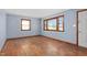 Bright living room showcasing hardwood floors and windows, freshly painted at 369 Albany St, Burlington, NC 27215