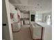 Unfinished kitchen featuring white cabinets, a kitchen island, and natural light at 381 Old Fashioned Way, Lillington, NC 27546