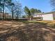 Spacious backyard featuring play set and large deck at 382 Tomahawk Dr, Clayton, NC 27520