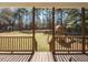 View of spacious backyard and playground from back porch at 382 Tomahawk Dr, Clayton, NC 27520