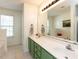 Bright bathroom with double sinks, vanity, and a large mirror at 382 Tomahawk Dr, Clayton, NC 27520