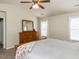 Bedroom featuring natural light, neutral walls, carpet, and a wooden dresser at 382 Tomahawk Dr, Clayton, NC 27520