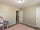 Bedroom with carpet flooring, closet, and door to hallway at 382 Tomahawk Dr, Clayton, NC 27520
