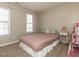Neutral bedroom features carpet flooring and two windows at 382 Tomahawk Dr, Clayton, NC 27520
