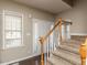 Welcoming foyer featuring hardwood floors, staircase, and a bright window at 382 Tomahawk Dr, Clayton, NC 27520