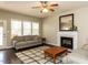 Comfortable living room showcasing a fireplace, wood flooring, and a neutral color palette at 382 Tomahawk Dr, Clayton, NC 27520