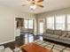 Open living room view to the dining area featuring hardwood floors and neutral tones at 382 Tomahawk Dr, Clayton, NC 27520