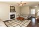 Inviting living room featuring a fireplace, ceiling fan, and a cozy seating area at 382 Tomahawk Dr, Clayton, NC 27520