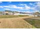 Spacious backyard showing the fence line and neighboring homes, offering a sense of community at 3925 Massey Pointe Ct, Raleigh, NC 27616