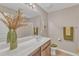 Bright bathroom with a modern vanity, large mirror, and well-lit space at 3925 Massey Pointe Ct, Raleigh, NC 27616