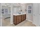 Bathroom featuring double vanity sinks, natural light, and a doorway into the bedroom at 3925 Massey Pointe Ct, Raleigh, NC 27616