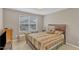 Comfortable bedroom with natural light, plush bedding, and ample storage space at 3925 Massey Pointe Ct, Raleigh, NC 27616