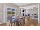 Cozy dining area with sliding door access to the backyard and open view to the living room at 3925 Massey Pointe Ct, Raleigh, NC 27616