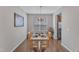 Cozy dining room with hardwood floors, a chandelier, and a view to the kitchen at 3925 Massey Pointe Ct, Raleigh, NC 27616
