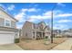 Charming two-story home with stone accents and a well-maintained lawn in a residential neighborhood at 3925 Massey Pointe Ct, Raleigh, NC 27616