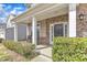 Inviting covered front porch with stone accents and comfortable rocking chairs at 3925 Massey Pointe Ct, Raleigh, NC 27616