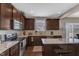 Modern kitchen with stainless steel appliances, granite counters, and ample cabinet storage space at 3925 Massey Pointe Ct, Raleigh, NC 27616