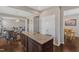 Well-equipped kitchen with a center island featuring a granite countertop, seamlessly connecting to the dining area at 3925 Massey Pointe Ct, Raleigh, NC 27616