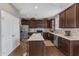 Updated kitchen with stainless steel appliances, granite countertops, and a convenient island with seating at 3925 Massey Pointe Ct, Raleigh, NC 27616