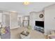 Open living room with neutral colors, carpet, and stairs to the next floor at 3925 Massey Pointe Ct, Raleigh, NC 27616