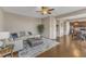 Open-concept living area with hardwood floors, a cozy seating arrangement, and easy access to the kitchen at 3925 Massey Pointe Ct, Raleigh, NC 27616