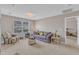 Comfortable living room with plush seating, neutral carpeting, and natural light at 3925 Massey Pointe Ct, Raleigh, NC 27616
