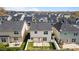 Aerial view of a home with a backyard, white fence, and patio area at 4044 Dunkirk Dr, Burlington, NC 27215