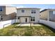 View of backyard with patio, pergola, green grass, and white fence at 4044 Dunkirk Dr, Burlington, NC 27215