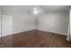Bedroom with neutral walls, ceiling fan and white door to the left at 4044 Dunkirk Dr, Burlington, NC 27215