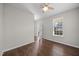 Neutral bedroom with hardwood flooring, a ceiling fan, and a bright window at 4044 Dunkirk Dr, Burlington, NC 27215