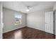 Bedroom featuring hardwood floors, a ceiling fan, and neighborhood views from a window at 4044 Dunkirk Dr, Burlington, NC 27215