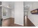 Inviting foyer with hardwood floors, neutral paint, and coat rack at 4044 Dunkirk Dr, Burlington, NC 27215