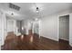 Hallway with hardwood floors, lighting fixtures, and laundry area at 4044 Dunkirk Dr, Burlington, NC 27215