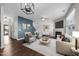 Inviting living room with hardwood floors, fireplace, and modern furnishings at 4044 Dunkirk Dr, Burlington, NC 27215