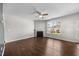 Open living room featuring a fireplace, ceiling fan and large window for plenty of natural light at 4044 Dunkirk Dr, Burlington, NC 27215
