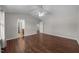 A spacious bedroom includes a ceiling fan, neutral walls, and a bathroom entrance at 4044 Dunkirk Dr, Burlington, NC 27215