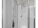Tiled stand up shower with a glass enclosure and chrome shower head at 4044 Dunkirk Dr, Burlington, NC 27215