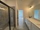 Bathroom featuring a long vanity, double sinks, modern lighting, and a shower at 4310 Emeline Way # 18, Fuquay Varina, NC 27526