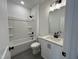 Contemporary bathroom featuring a shower-tub combo, toilet, and vanity sink at 4310 Emeline Way # 18, Fuquay Varina, NC 27526