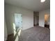Spacious bedroom with neutral carpet and multiple doorways leading to other rooms at 4310 Emeline Way # 18, Fuquay Varina, NC 27526