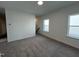 A carpeted bedroom with natural light coming through the windows at 4310 Emeline Way # 18, Fuquay Varina, NC 27526