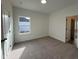 Bright bedroom features neutral carpet, a window, and fresh white walls at 4310 Emeline Way # 18, Fuquay Varina, NC 27526