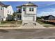 Charming two-story home with a modern design and a well-manicured front yard at 4310 Emeline Way # 18, Fuquay Varina, NC 27526